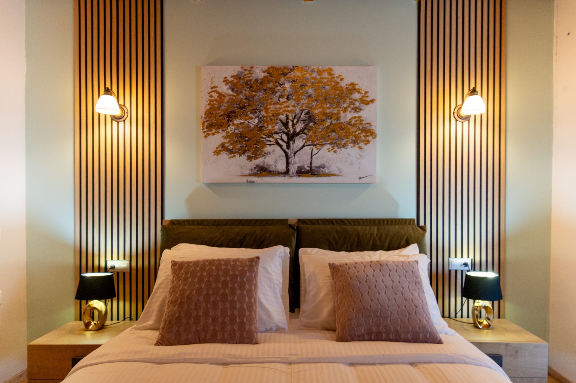 Bedroom with wood-slat accent walls and warm lighting