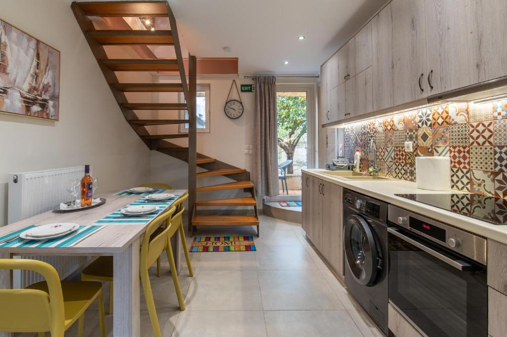 Kitchen and dining area with wooden staircase